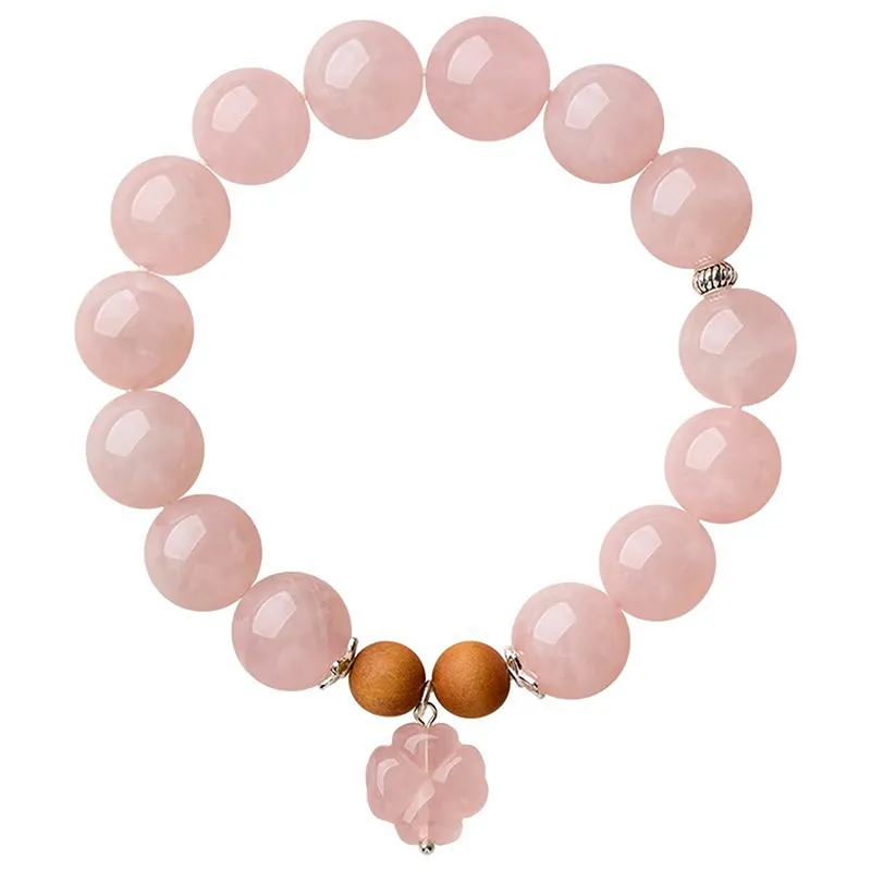 Natural Rose Quartz bracelet with flower charm for Love & Harmony on white background