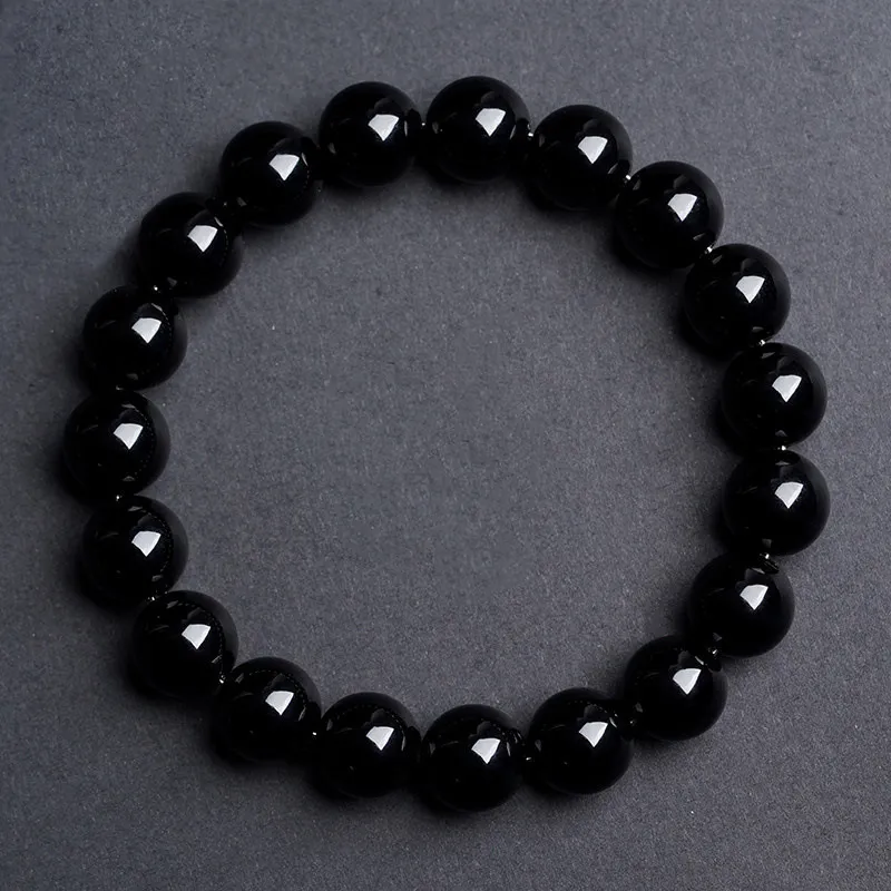 Natural Obsidian bracelet for Protection & Grounding on dark grey background