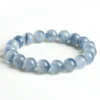 Natural Blue Rutilated Quartz bracelet for Wealth & Success on white background