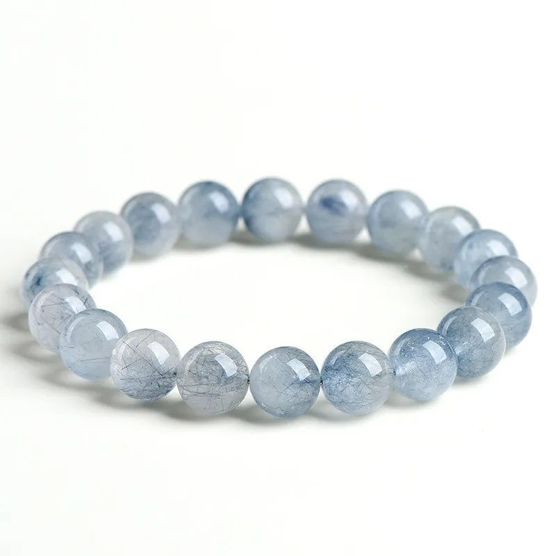 Natural Blue Rutilated Quartz bracelet for Wealth & Success on white background