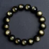 SCPGOBS1 Natural Golden Sheen Obsidian bracelet for Protection & Manifestation on dark gray background