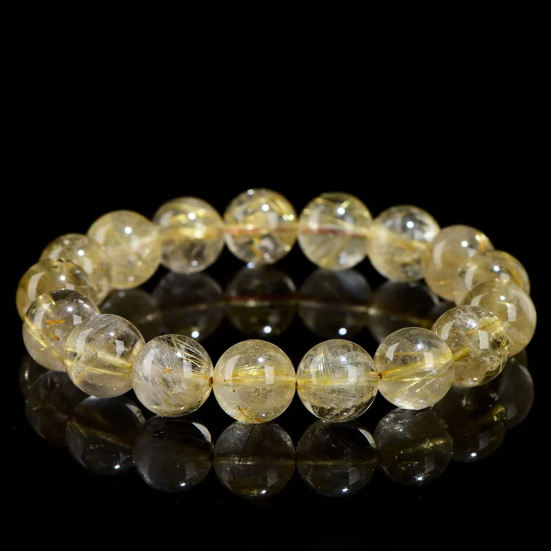 SCPGRU01S1 Natural Rutilated Quartz bracelet for Wealth & Success on black reflective background