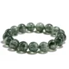 SCPGRU02E1 Natural Green Rutilated Quartz bracelet for Wealth & Success with dark needle inclusions on white background