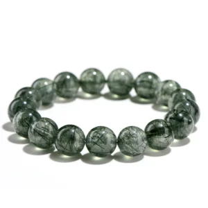 Natural Green Rutilated Quartz bracelet for Wealth & Success with dark needle inclusions on white background