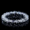 Natural Clear Quartz bracelet for Spiritual & Intuition on black reflective background