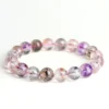 Natural Super Seven bracelet for Spiritual & Intuition showing amethyst and rutile inclusions on white background