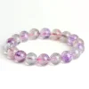 Natural Super Seven bracelet for Spiritual & Intuition showing amethyst and rutile inclusions on white background