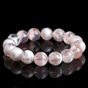 Natural White Phantom Quartz bracelet for Wealth & Success on black reflective background
