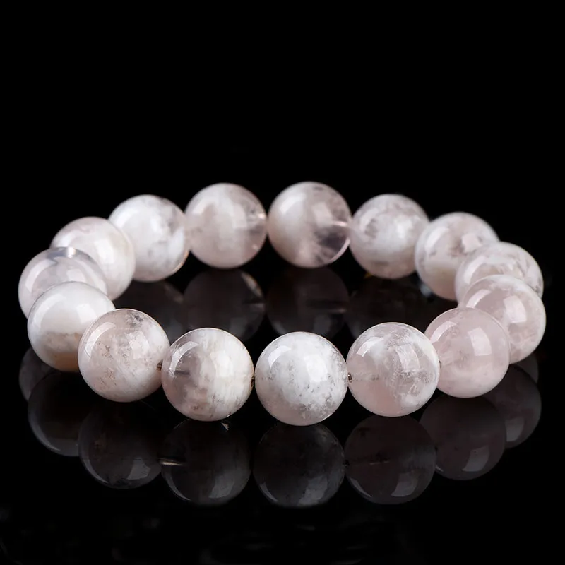 Natural White Phantom Quartz bracelet for Wealth & Success on black reflective background