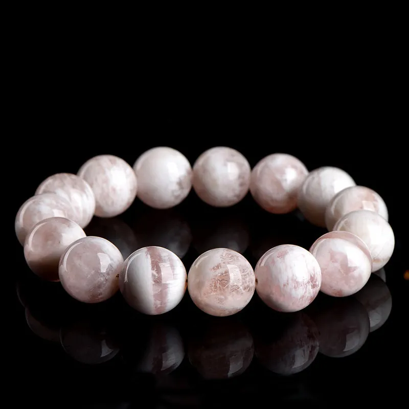 Natural White Phantom Quartz bracelet for Wealth & Success on black reflective background