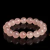 Natural Rose Quartz bracelet for Love & Harmony on black reflective background