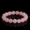 Natural Rose Quartz bracelet for Love & Harmony on black reflective background