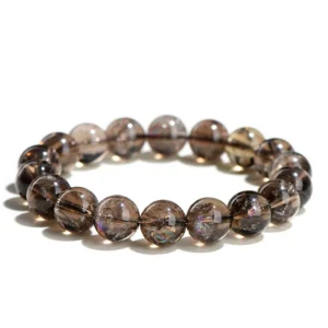 Natural Smoky Quartz bracelet for grounding and protection showing translucent brown beads with rainbow inclusions on white background