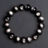 SCPSOBS1 Natural Silver Sheen Obsidian bracelet for Protection & Inner Clarity on dark gray background