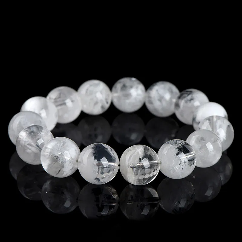 Natural Clear Quartz bracelet for Spiritual & Intuition on black reflective background