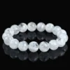 Natural Clear Quartz bracelet for Spiritual & Intuition on black reflective background