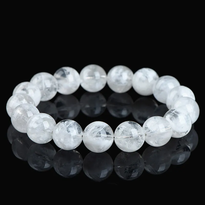 Natural Clear Quartz bracelet for Spiritual & Intuition on black reflective background