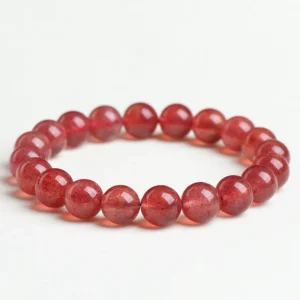 Natural Strawberry Quartz bracelet for Love & Harmony on white background