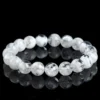 Natural Phantom Quartz bracelet for Wealth & Success on black reflective background