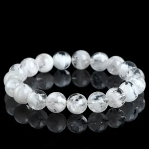 Natural Phantom Quartz bracelet for Wealth & Success on black reflective background