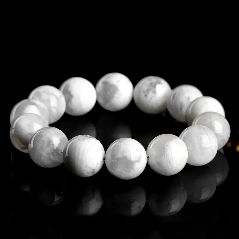 Natural Phantom Quartz bracelet for Wealth & Success on black reflective background