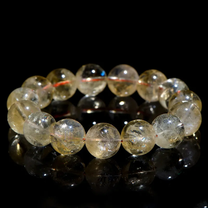 Natural Citrine bracelet for Wealth & Success on black reflective background
